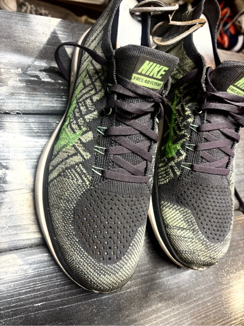 Nike Black and Neon Green Flyknit Running Shoes size 10